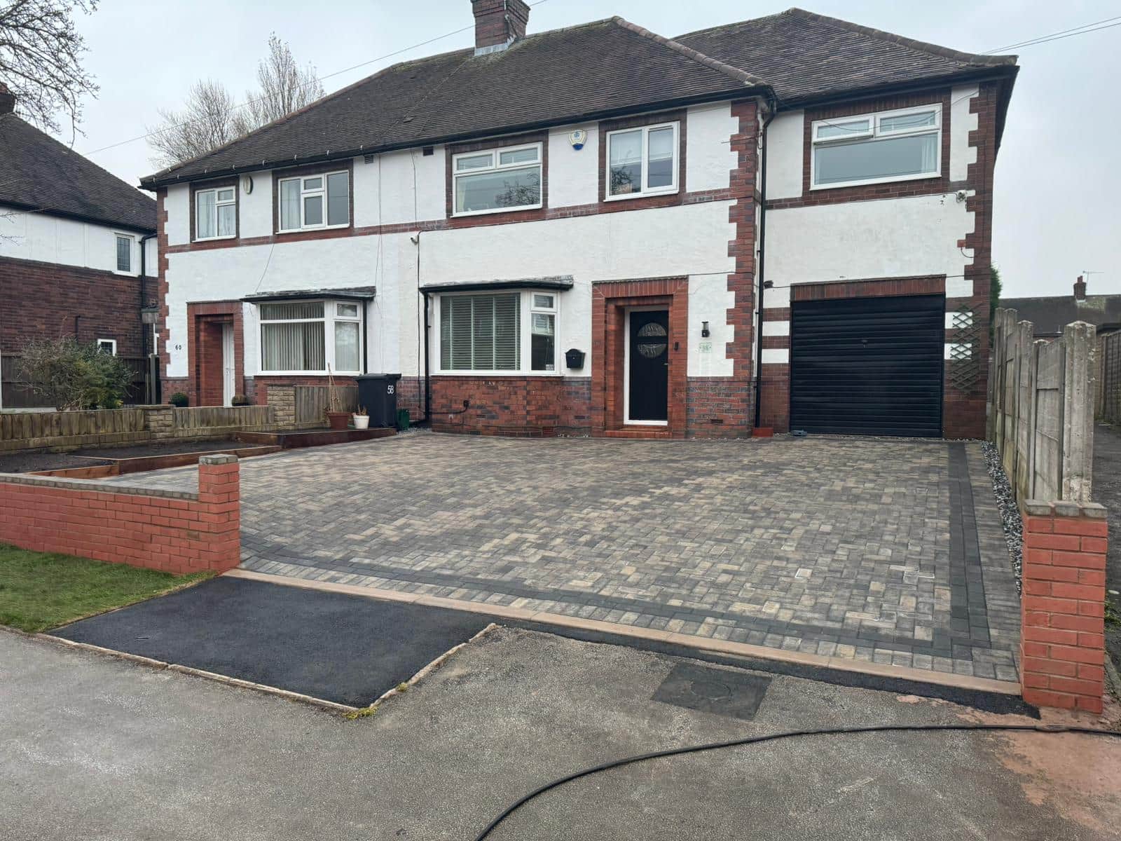 Completed block-paved driveway across the front of a semi-detached home