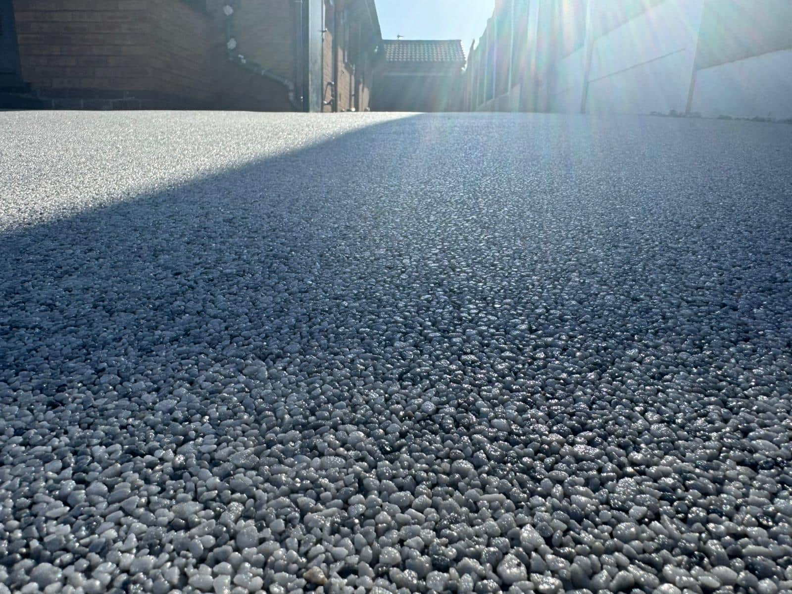 Close-up showing the mixed aggregate texture of a resin-bound surface